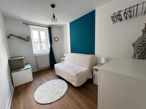 Giường trong phòng chung tại Le Nid des Saveurs