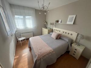 En eller flere senge i et værelse på Apartamento Velecio