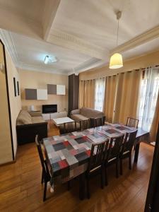 a living room with a table and chairs and a couch at Apartamentos Turia in Valencia +110 photos