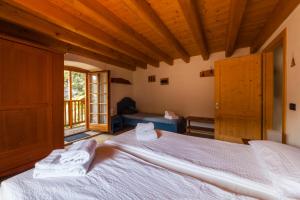 Postel nebo postele na pokoji v ubytování B&B Arlanch 8