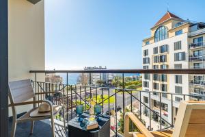 a balcony with a view of a building at Forum Ocean View 5B by Homie in Ilhéu do Gorgulho