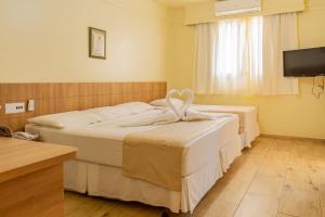 Cama ou camas em um quarto em Hotel Colonial Iguaçu