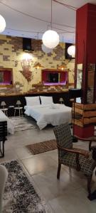 Posteľ alebo postele v izbe v ubytovaní 1920s Rooms