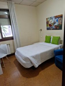 Postel nebo postele na pokoji v ubytování Hostal Real