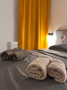 two towels on a bed in a bedroom at Dele Apartment Free Parking in Sarajevo