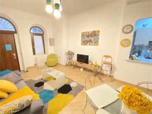 a living room with a couch and a table at Casa Anacleto in Iglesias +12 photos