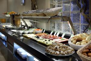 a buffet line with many different types of food at Exe Vienna in Vienna