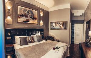 Posteľ alebo postele v izbe v ubytovaní Alfons Boutique Hotel