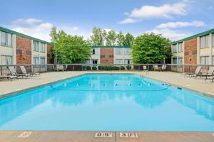 a large swimming pool in front of a building at Motel 6 Rock Hill SC in Rock Hill