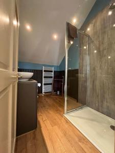 a bathroom with a shower and a sink at The Cruachan Stoer in Stoer +39 photos