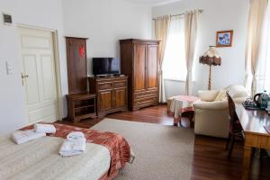 Posteľ alebo postele v izbe v ubytovaní Hotel Napoleon