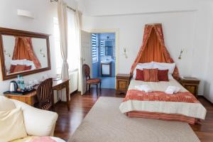 Posteľ alebo postele v izbe v ubytovaní Hotel Napoleon