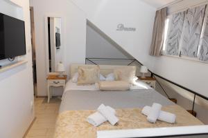 TV a/nebo společenská místnost v ubytování Central Split rooms and apartments Paese