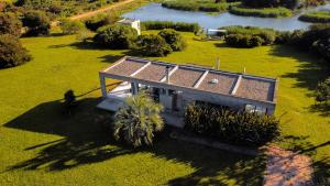 an overhead view of a house with a roof at Casa Las Vistillas -La Pedrera- con lago privado a metros del Mar in Rocha