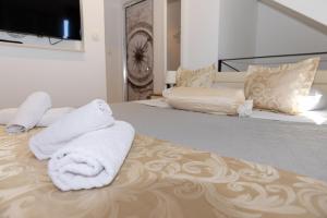 Ένα ή περισσότερα κρεβάτια σε δωμάτιο στο Central Split rooms and apartments Paese