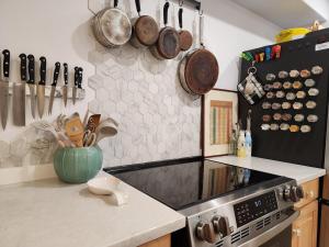 a kitchen with a stove and pots and pans at 3BR Oasis with Pool in Cocoa in Cocoa