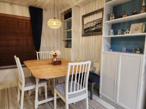 a dining room with a wooden table and chairs at 3BR Oasis with Pool in Cocoa in Cocoa