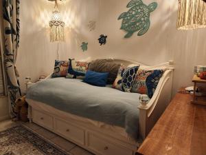a bedroom with a bed with pillows on it at 3BR Oasis with Pool in Cocoa in Cocoa