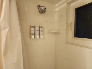 a bathroom with a shower with a shower curtain at 3BR Oasis with Pool in Cocoa in Cocoa