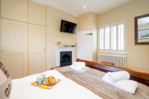 Katil atau katil-katil dalam bilik di Pebble Cottage - 6 Victoria Rd - Aldeburgh Coastal Cottages