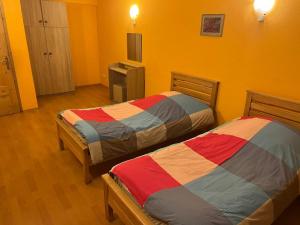 Voodi või voodid majutusasutuse Galaxy Hostel toas