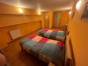 Voodi või voodid majutusasutuse Galaxy Hostel toas