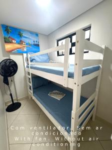 a white bunk bed in a room with a painting at Landscape@UrbanBeach -200 m² de puro luxo in Fortaleza +40 photos