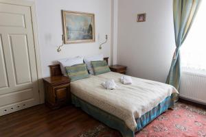 Posteľ alebo postele v izbe v ubytovaní Hotel Napoleon