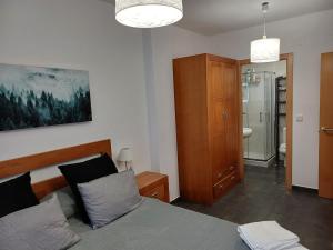 Ένα ή περισσότερα κρεβάτια σε δωμάτιο στο Xove Home Mar de Lugo