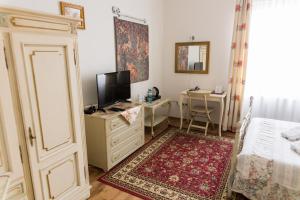 Posteľ alebo postele v izbe v ubytovaní Hotel Napoleon