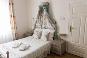 Posteľ alebo postele v izbe v ubytovaní Hotel Napoleon
