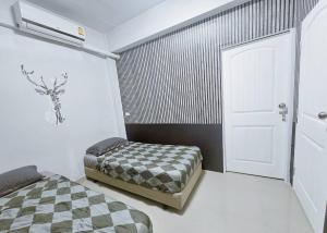 Postel nebo postele na pokoji v ubytování Future Hostel Pattaya