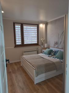 Postel nebo postele na pokoji v ubytování Cosy Space Apartment