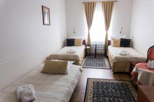 Posteľ alebo postele v izbe v ubytovaní Hotel Napoleon