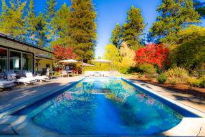 a swimming pool in the middle of a yard at Luxe Villa Estate, Sonoma, Private Creek, Hot Tub, Pool, Bocce in Sebastopol