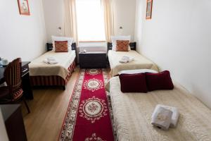 Posteľ alebo postele v izbe v ubytovaní Hotel Napoleon