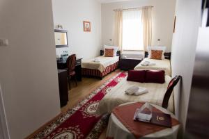 Posteľ alebo postele v izbe v ubytovaní Hotel Napoleon