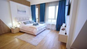 Rúm í herbergi á Relax sauna apartman