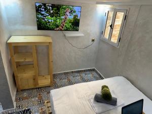 Μια τηλεόραση ή/και κέντρο ψυχαγωγίας στο Surf home Appartement