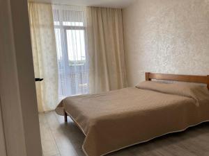 Postel nebo postele na pokoji v ubytování AVALON Apart-Hotel
