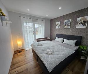 a bedroom with a large bed with flowers on it at Ferienwohnung in Bad Laasphe