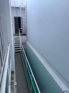 a hallway of a building with stairs in a building at Posada don rulo in Mazatlán