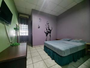 TV a/nebo společenská místnost v ubytování La Colonia Cama Matrimonial