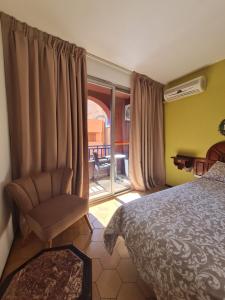 Postel nebo postele na pokoji v ubytování Hotel Tachfine