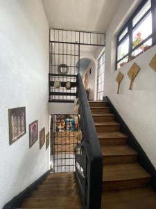 a staircase in a house with a stair case at El Monasterio in Quito +34 photos