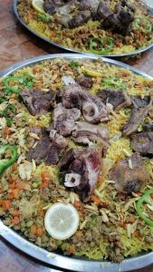two plates of food sitting on a table at الخريطه هاوس in Tall al Misţāḩ +9 photos