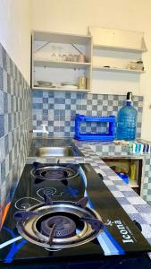 Kuchyň nebo kuchyňský kout v ubytování Backpackers Paradise