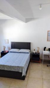 Postel nebo postele na pokoji v ubytování Espaço inteiro perto das praias e do rio Vaza Barris