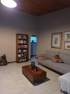 a living room with a couch and a coffee table at Loft nas Montanhas! in Nova Lima
