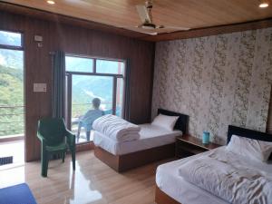 Postel nebo postele na pokoji v ubytování Chaukhamba view Resort + 17 fotografií